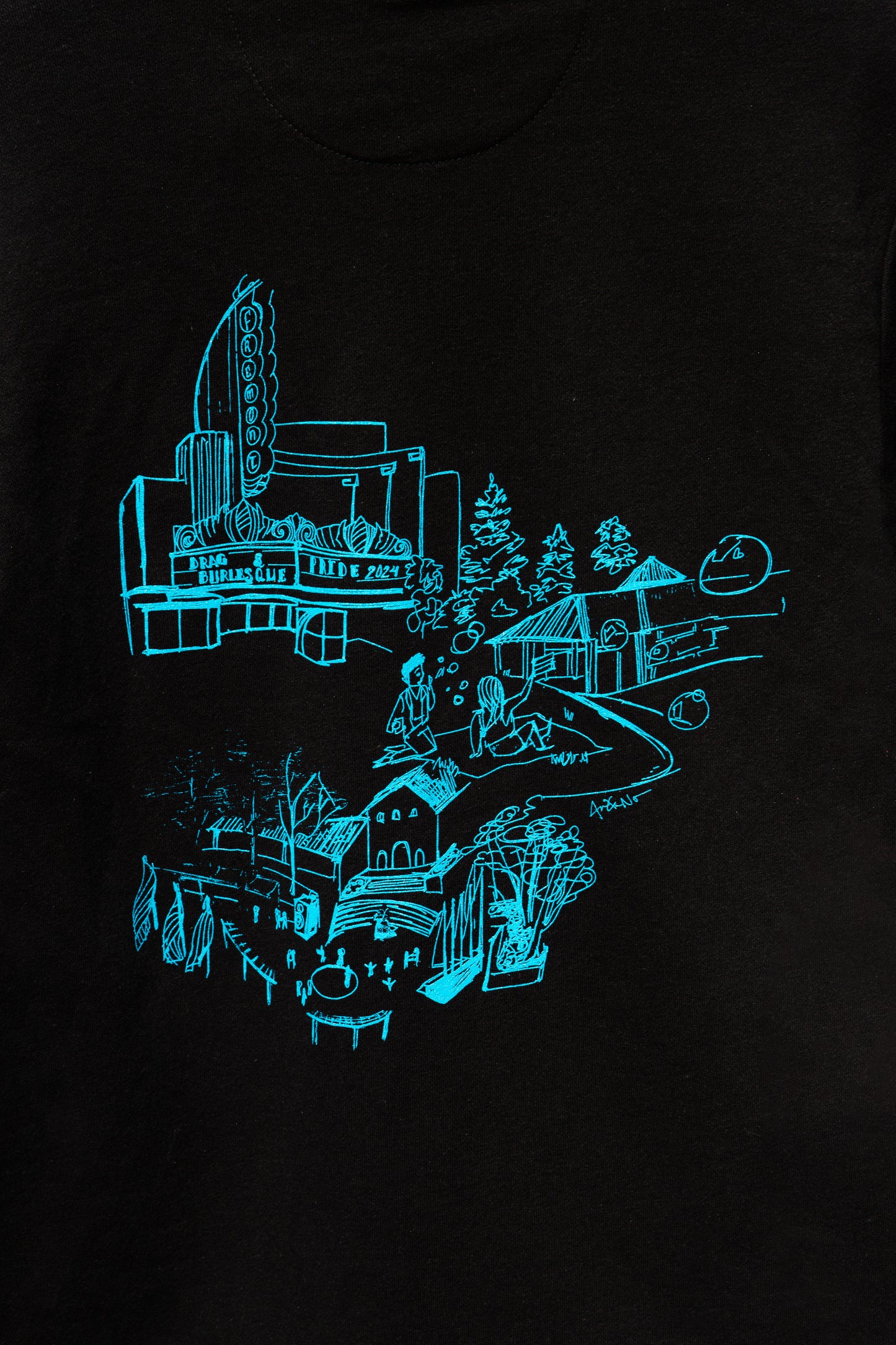 Focused image of the design for <PLACE> on the black sweater.