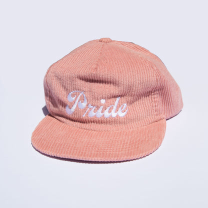 Pink corduroy hat with the text "Pride" on the front.