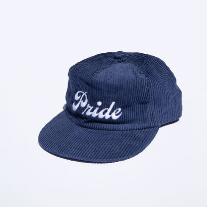 Navy blue corduroy hat with the text "Pride" on the front.