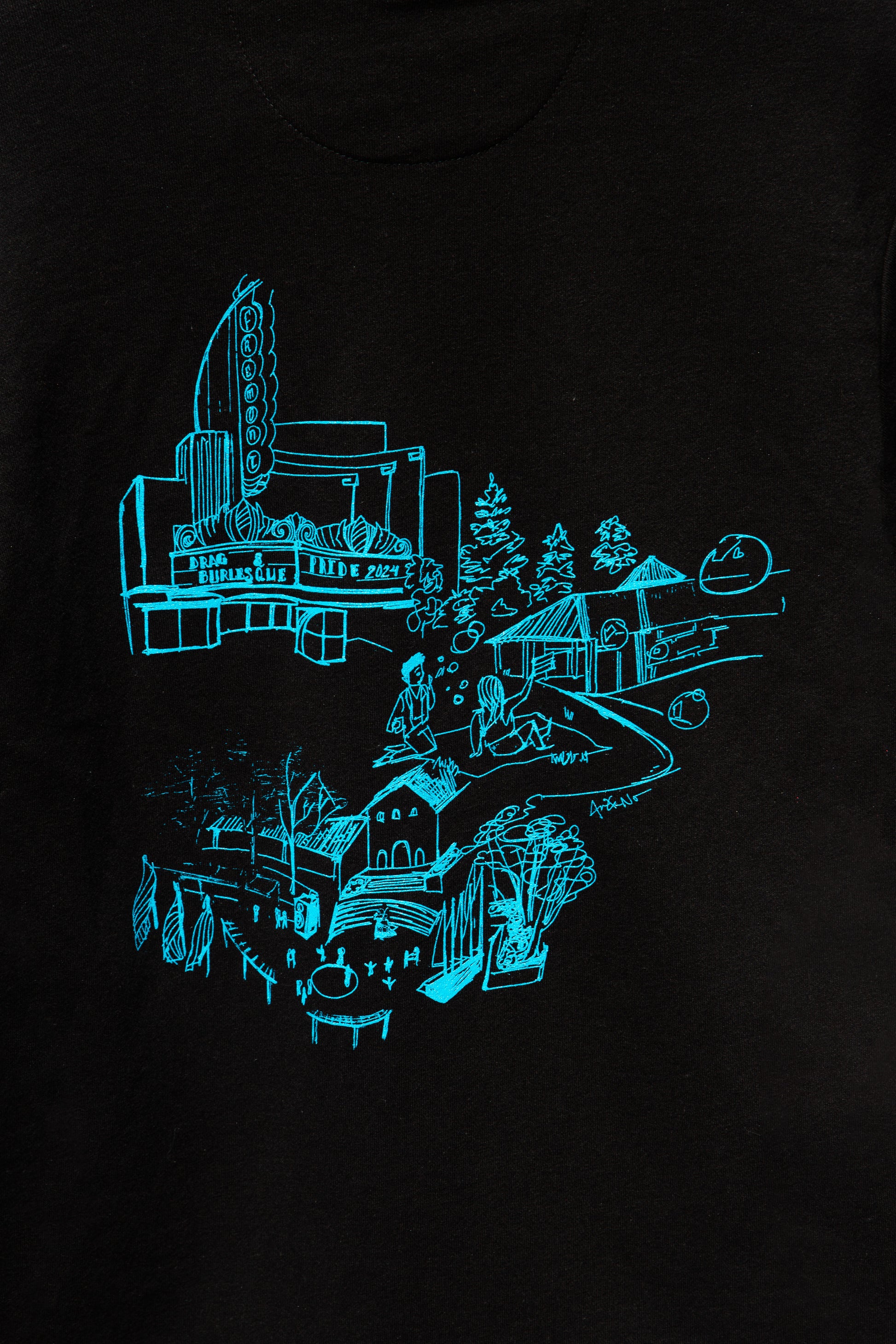 Focused image of the design for <PLACE> on the black sweater.